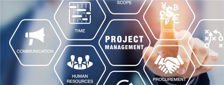 Man in background pointing to project management graphics