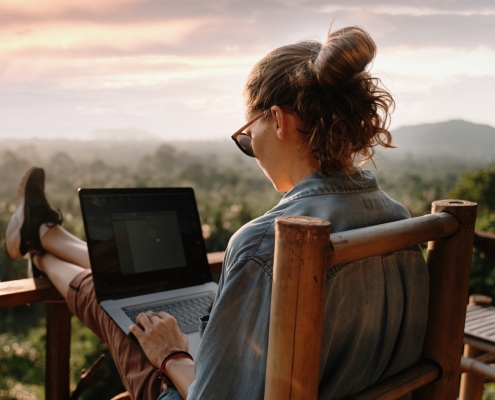Woman on Laptop with View